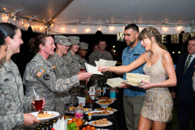Taylor Swift and Travis Kelce Deliver Heartwarming Surprise to U.S. Troops: First-Ever Wedding Invites Hand-Delivered at Military Base!